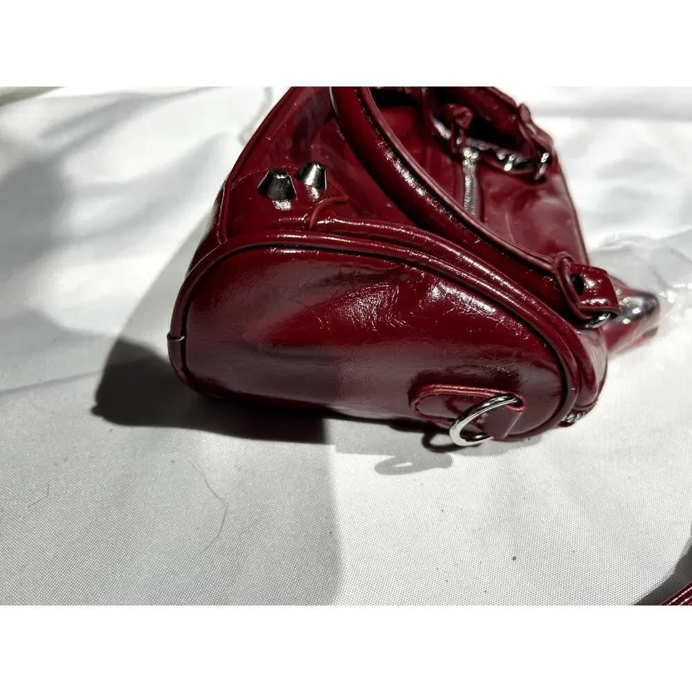 NWOT Deep Red Vegan Leather Handbag with Crossbody Strap and‎ Bag charms